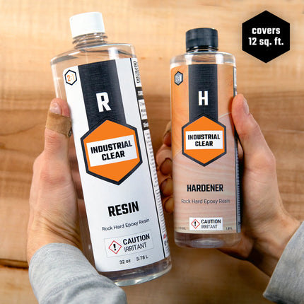 Two bottles, one labeled as resin and the other as hardener, for a 48 oz kit of rock-hard epoxy resin.